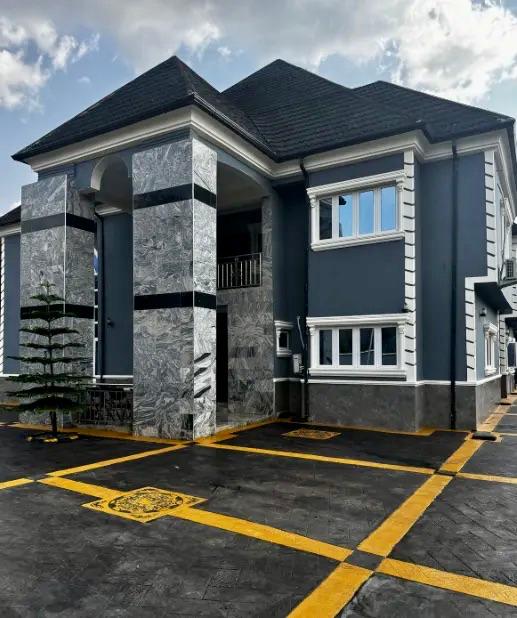 Completed residential building with freshly painted walls and interlocking driveway